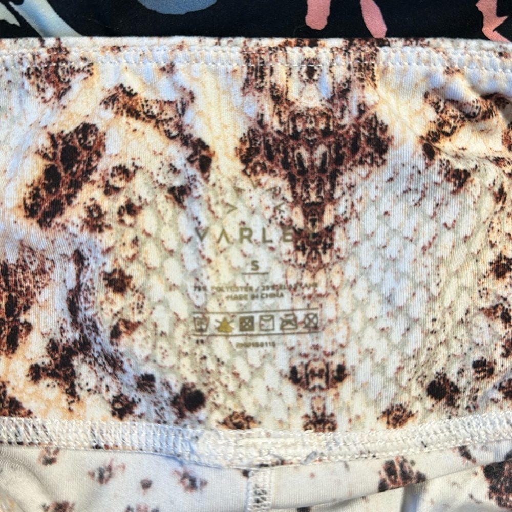 Varley snake skin leggings with side pockets.